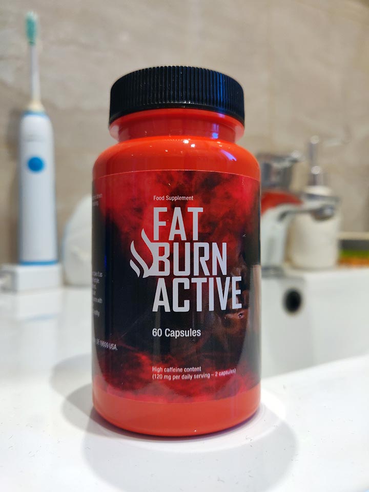 Fat Burn Active 11 black and red bottle and box of pills with white letters.