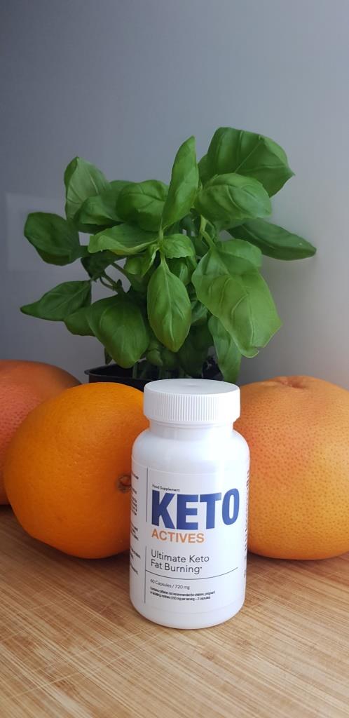 Keto Actives 11 white pill bottle with blue lettering and some orange.