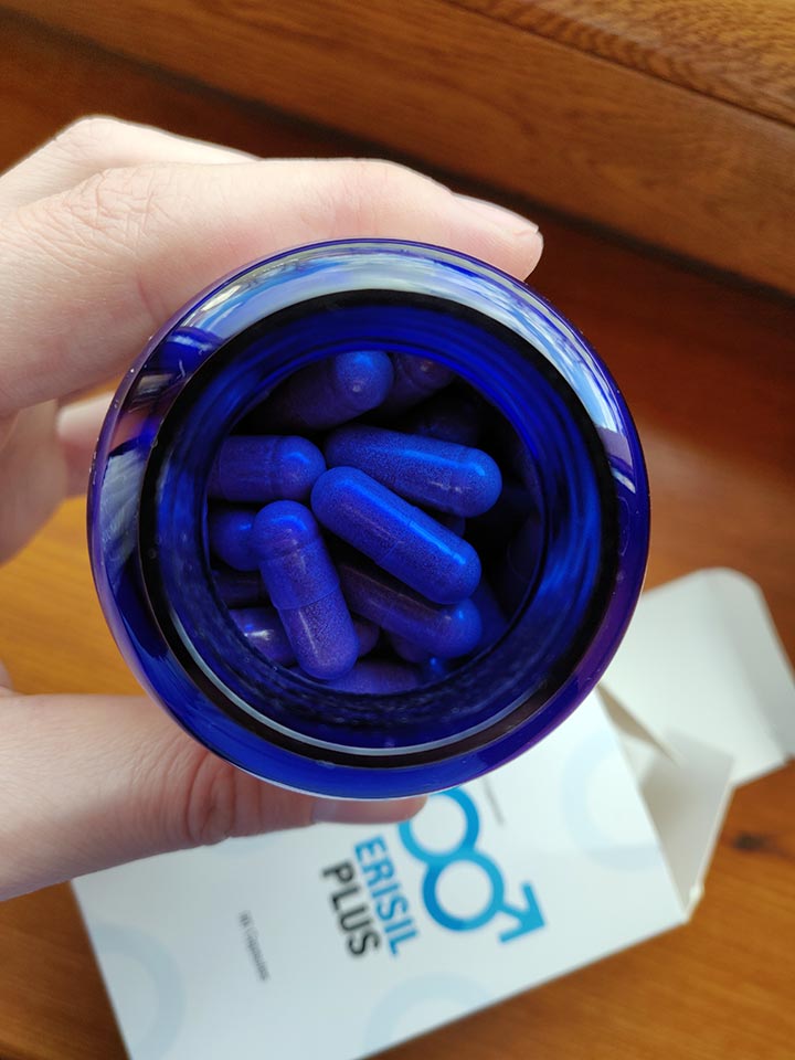 Erisil Plus 19 blue and white pill bottle with blue lettering, white box with blue lettering.