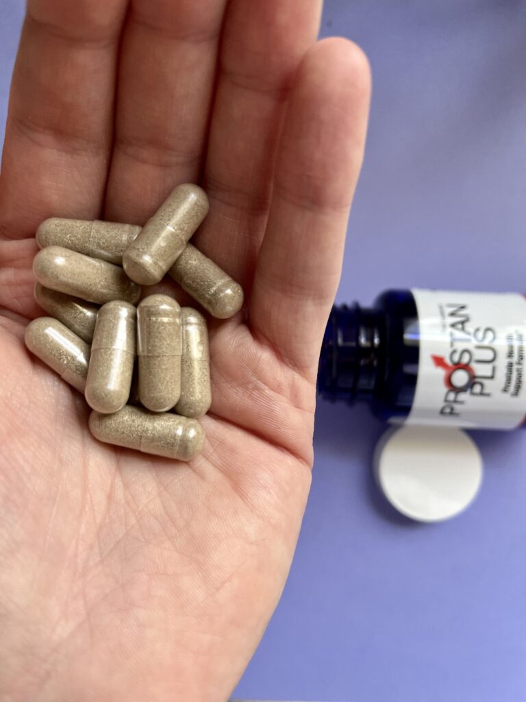 Prostate 15 a hand with some pills.