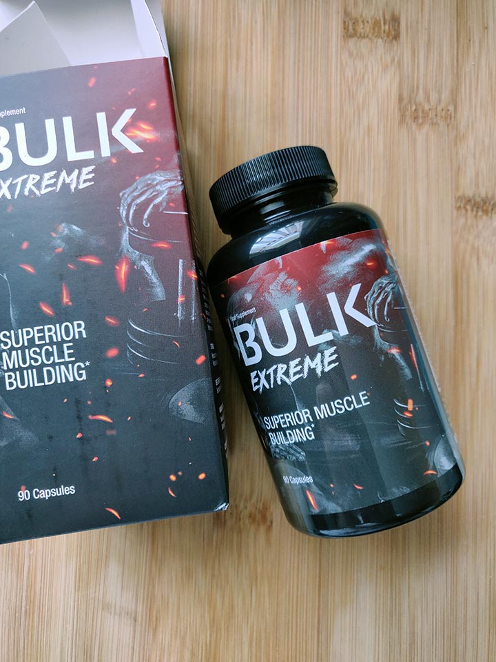 Bulk Extreme 9 Image of a red and black box and packaging with a photo of a supplement bottle and white letters