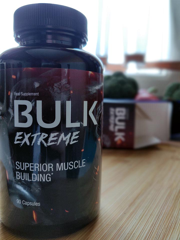 Bulk Extreme 10 Image of a red and black box and packaging with a photo of a supplement bottle and white letters
